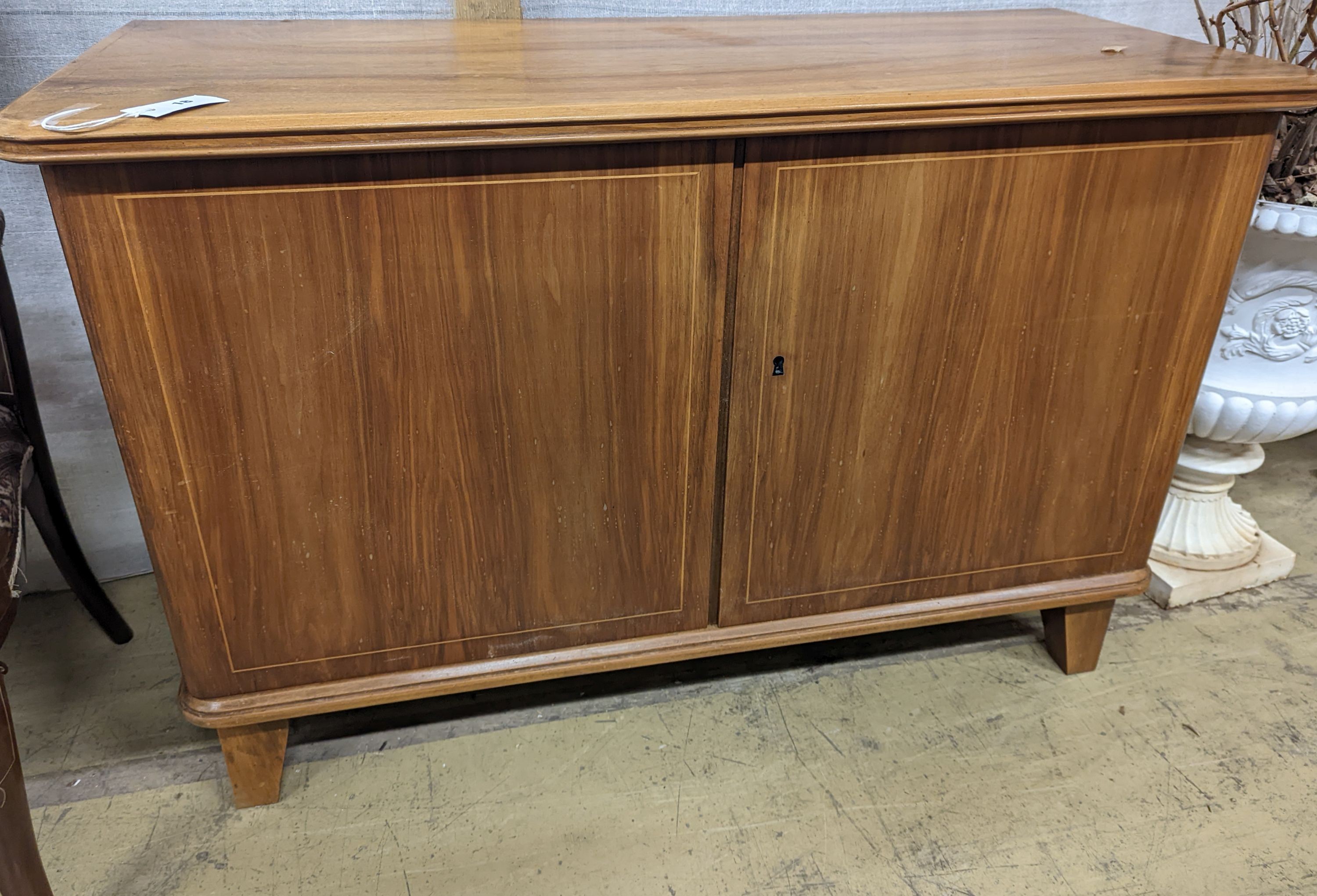 A Gordon Russell style walnut two door sideboard, width 116cm, depth 48cm, height 78cm